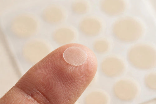 ZitVanish hydrocolloid pimple patch close-up showing ultra-thin design